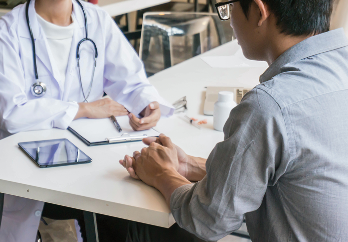 Doctor consulting with patient